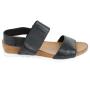 Women's black leather sandals with brown platforms and white soles and velcro