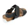 Women's black leather sandals with brown platforms and white soles and velcro