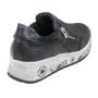 Women's black leather trainers on black and white soles