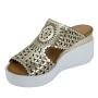 Women's gold leather sandals with perforation on white platforms