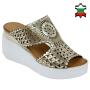 Women's gold leather sandals with perforation on white platforms