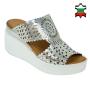 Women's silver leather sandals with perforation on white platforms