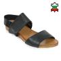 Women's black leather sandals with brown platforms and white soles and velcro